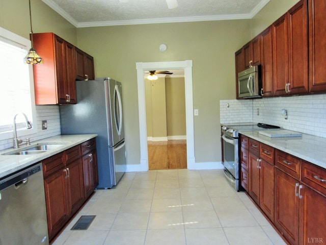 1697 S Amherst Hwy, Amherst, VA 24521 - kitchen featuring appliances with stainless steel finishes, a sink, ceiling fan, decorative backsplash, and crown molding