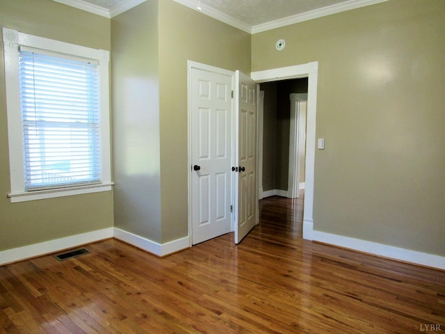 1697 S Amherst Hwy, Amherst, VA 24521 - unfurnished bedroom with ornamental molding, baseboards, and wood finished floors