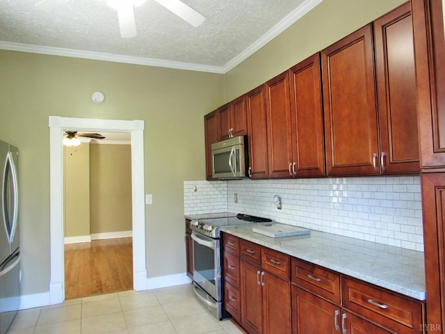 1697 S Amherst Hwy, Amherst, VA 24521 - kitchen featuring stainless steel appliances, a ceiling fan, a textured ceiling, crown molding, and light stone counters