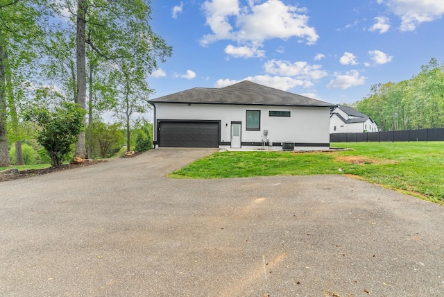 1208 Rocky Branch Dr, Forest, VA 24551 - view of front of property with driveway, an attached garage, central AC, and stucco siding