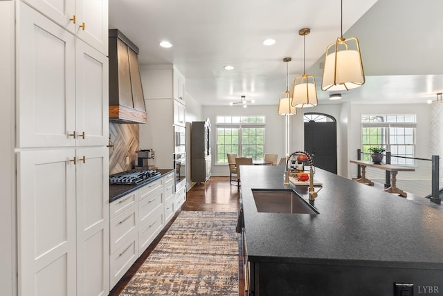 1208 Rocky Branch Dr, Forest, VA 24551 - kitchen with a sink, dark countertops, recessed lighting, gas cooktop, and white cabinets
