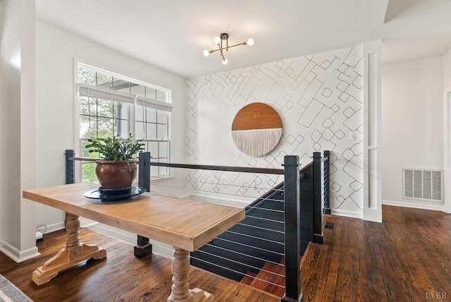 1208 Rocky Branch Dr, Forest, VA 24551 - dining area with an accent wall, baseboards, and wood finished floors