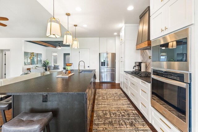 1208 Rocky Branch Dr, Forest, VA 24551 - kitchen featuring stainless steel appliances, a ceiling fan, a sink, dark countertops, and custom range hood