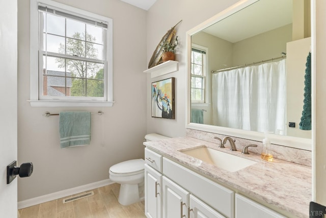 1208 Rocky Branch Dr, Forest, VA 24551 - full bath with baseboards, toilet, vanity, wood finished floors, and a shower with curtain