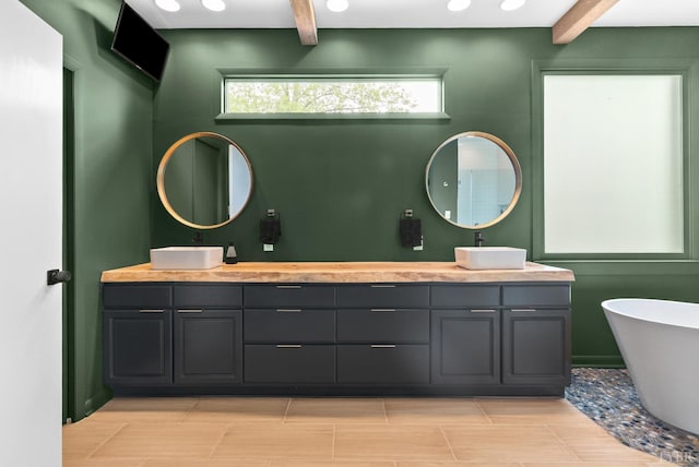 1208 Rocky Branch Dr, Forest, VA 24551 - full bathroom with beamed ceiling, a soaking tub, and double vanity