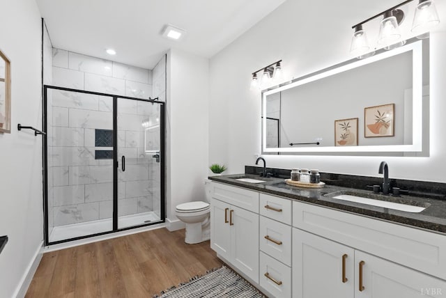 3494 Double Bridges Rd Lot 8, Spout Spring, VA 24593 - full bathroom with wood finished floors, toilet, a stall shower, double vanity, and baseboards