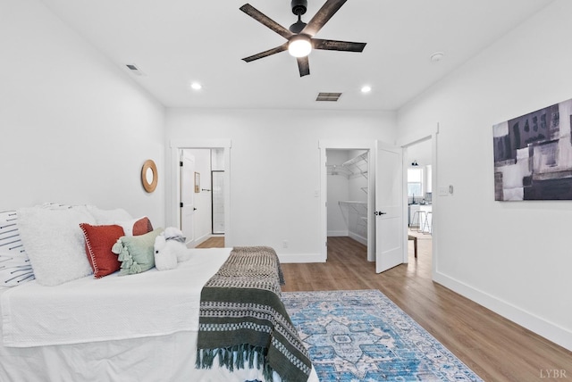 3494 Double Bridges Rd Lot 8, Spout Spring, VA 24593 - bedroom with wood finished floors, baseboards, a walk in closet, recessed lighting, and ceiling fan