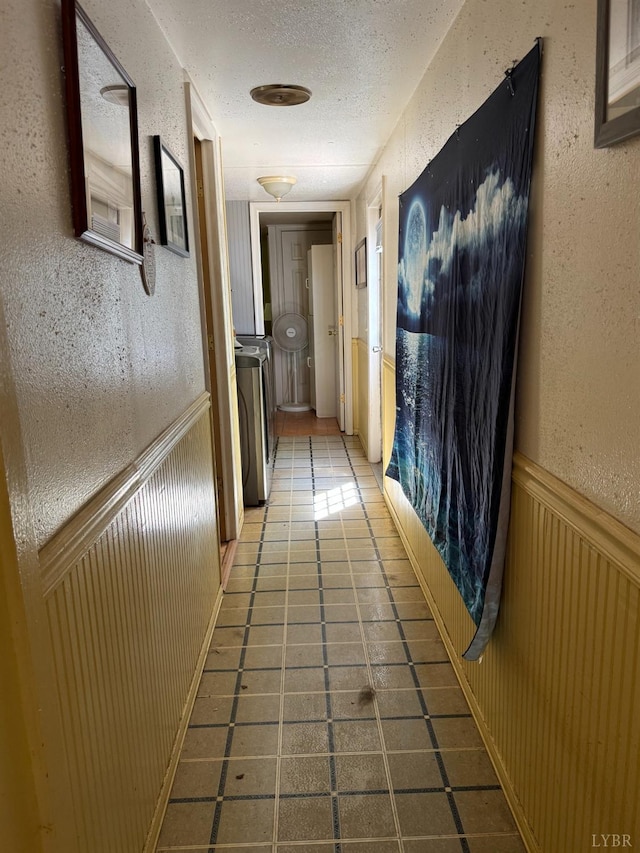 202 Stallion Way, Amherst, VA 24521 - corridor with tile patterned floors, washer / clothes dryer, a wainscoted wall, a textured ceiling, and a textured wall
