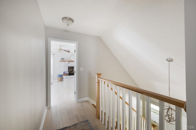 1132 Bancroft, Goode, VA 24556 - hall with baseboards, wood finished floors, vaulted ceiling, and an upstairs landing