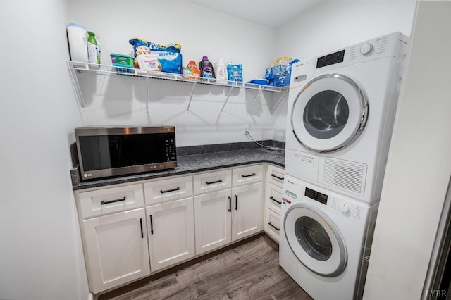1132 Bancroft, Goode, VA 24556 - laundry room with laundry area, dark wood finished floors, and stacked washer / dryer