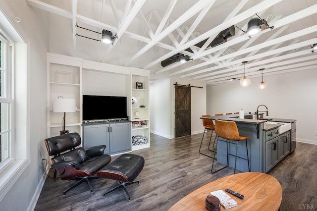1132 Bancroft, Goode, VA 24556 - living room featuring baseboards, vaulted ceiling with beams, dark wood-style floors, and a barn door