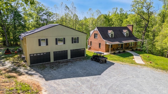 1132 Bancroft, Goode, VA 24556 - view of front of property featuring covered porch, driveway, a chimney, a front yard, and a view of trees