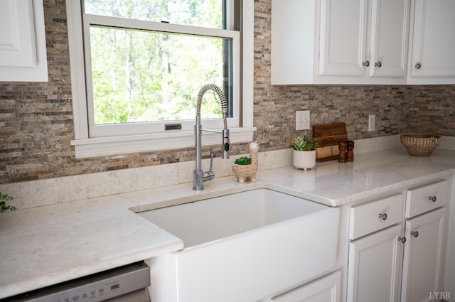 1132 Bancroft, Goode, VA 24556 - kitchen with a sink, dishwashing machine, decorative backsplash, and white cabinetry