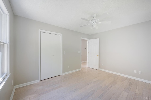 1132 Bancroft, Goode, VA 24556 - unfurnished bedroom featuring a closet, baseboards, and light wood-style floors