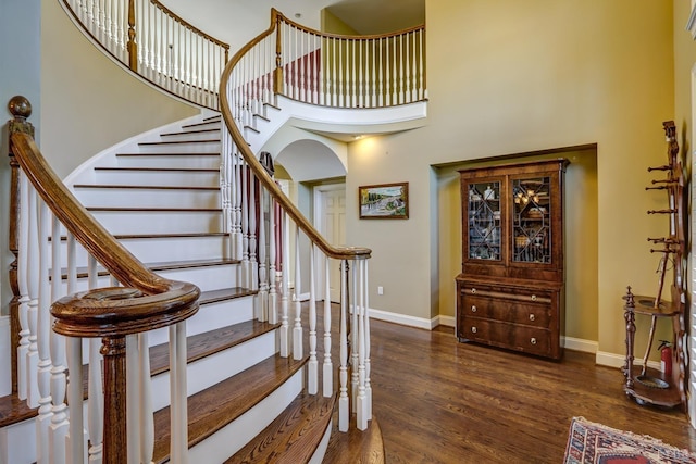 107 Emory Way, Amherst, VA 24521 - stairs with wood finished floors, baseboards, a towering ceiling, and arched walkways