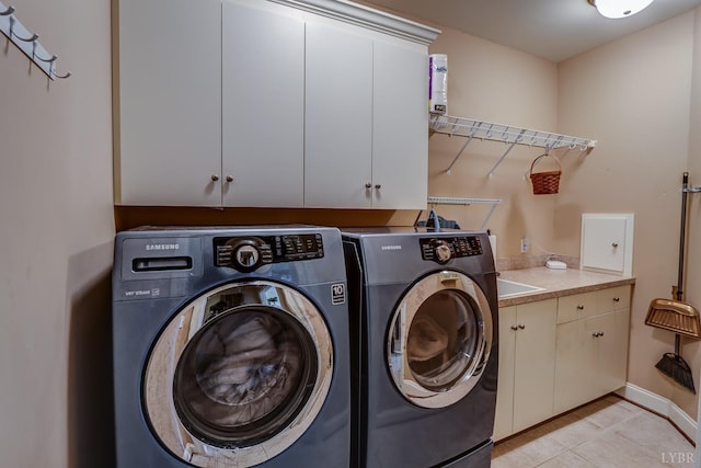 107 Emory Way, Amherst, VA 24521 - clothes washing area featuring light tile patterned flooring, cabinet space, and independent washer and dryer