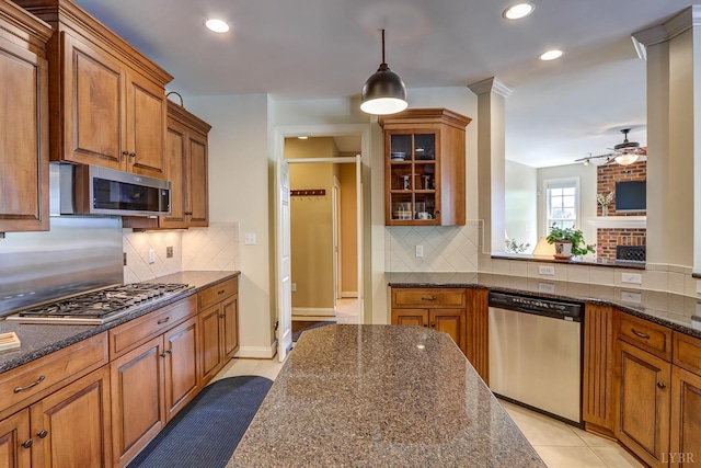 107 Emory Way, Amherst, VA 24521 - kitchen with brown cabinetry, stainless steel appliances, tasteful backsplash, and ceiling fan