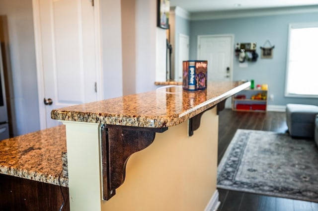 44 Sprouse Ln, Lynchburg, VA 24502 - kitchen featuring dark wood-style floors, baseboards, a breakfast bar, and stone countertops