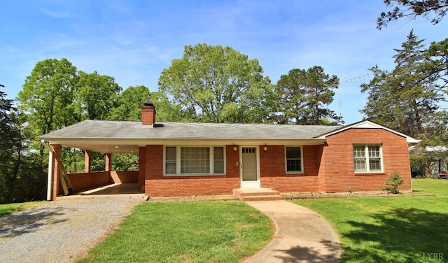 3958 Campbell Hwy, Lynchburg, VA 24501 - view of front facade featuring gravel driveway, brick siding, a chimney, a front yard, and an attached carport
