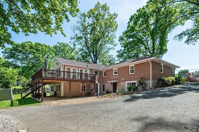 1206 Cedar Hill Dr, Lynchburg, VA 24502 - view of front facade featuring a deck, stairs, driveway, and a front yard