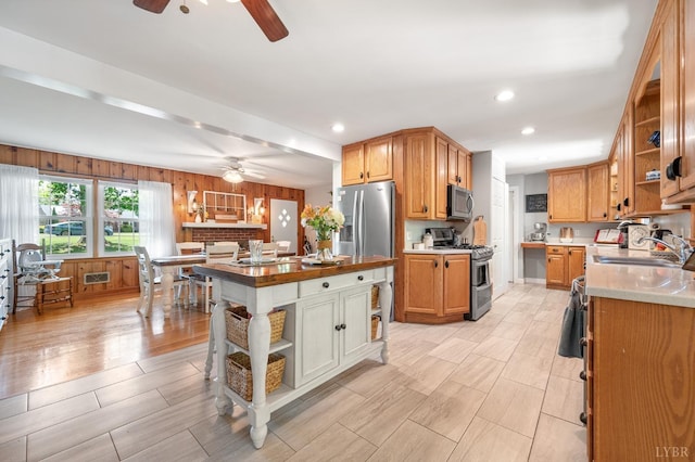 1206 Cedar Hill Dr, Lynchburg, VA 24502 - kitchen featuring appliances with stainless steel finishes, open shelves, ceiling fan, recessed lighting, and a center island