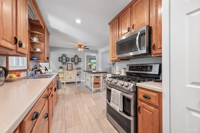 1206 Cedar Hill Dr, Lynchburg, VA 24502 - kitchen featuring appliances with stainless steel finishes, open shelves, light countertops, brown cabinetry, and a ceiling fan