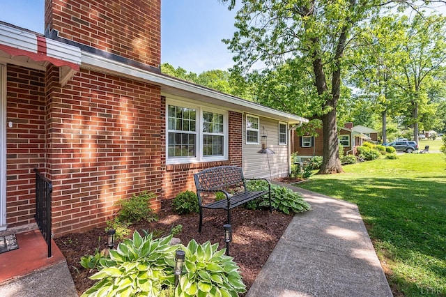 1206 Cedar Hill Dr, Lynchburg, VA 24502 - property entrance with a yard and brick siding