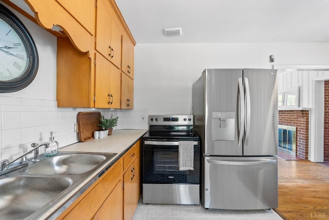4600 Greenwood Dr, Lynchburg, VA 24502 - kitchen with stainless steel appliances, a sink, and backsplash
