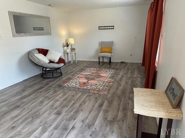 202 Rustwood Ct, Rustburg, VA 24588 - living area featuring baseboards and wood finished floors