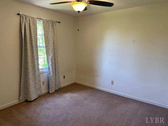202 Rustwood Ct, Rustburg, VA 24588 - unfurnished room with baseboards, a ceiling fan, carpet flooring, and a wealth of natural light