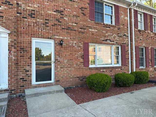 202 Rustwood Ct, Rustburg, VA 24588 - property entrance featuring brick siding