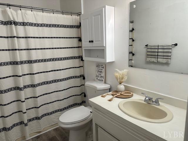 202 Rustwood Ct, Rustburg, VA 24588 - bathroom featuring toilet, a shower with curtain, and vanity