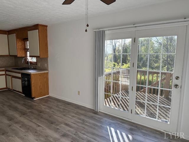202 Rustwood Ct, Rustburg, VA 24588 - kitchen with a ceiling fan, wood finished floors, black dishwasher, tasteful backsplash, and a sink