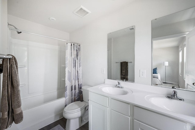 2641 Confederate Ave, Lynchburg, VA 24501 - ensuite bathroom with double vanity, toilet, shower / tub combo, and wood finished floors