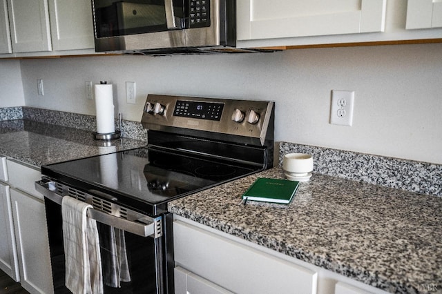 2641 Confederate Ave, Lynchburg, VA 24501 - kitchen featuring appliances with stainless steel finishes, dark stone counters, and white cabinetry