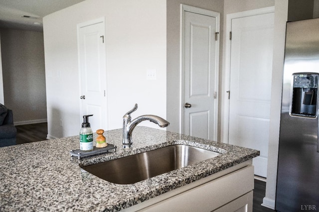 2641 Confederate Ave, Lynchburg, VA 24501 - kitchen with stainless steel refrigerator with ice dispenser, a sink, stone countertops, dark wood-style floors, and recessed lighting
