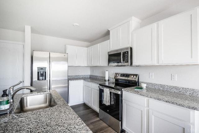 2641 Confederate Ave, Lynchburg, VA 24501 - kitchen with appliances with stainless steel finishes, a sink, white cabinets, and dark wood finished floors