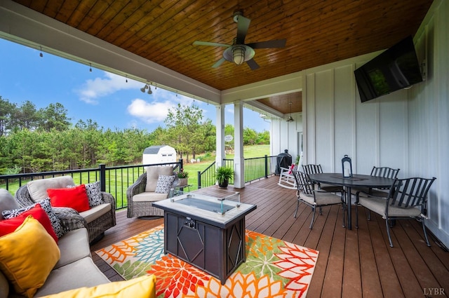 1205 Bradford Crossing Pl, Goode, VA 24556 - deck with ceiling fan, outdoor dining area, and an outdoor living space with a fire pit