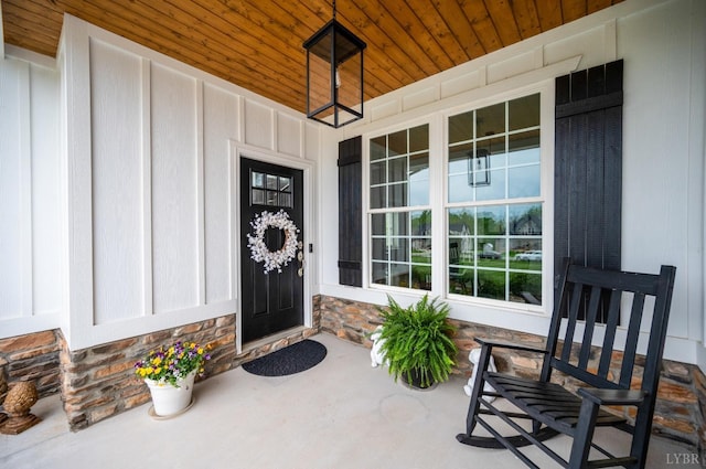 1205 Bradford Crossing Pl, Goode, VA 24556 - property entrance with board and batten siding, covered porch, and stone siding