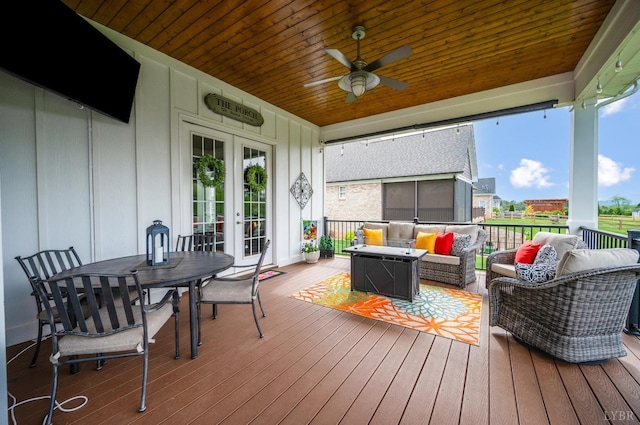 1205 Bradford Crossing Pl, Goode, VA 24556 - wooden terrace with an outdoor living space, outdoor dining area, ceiling fan, and french doors