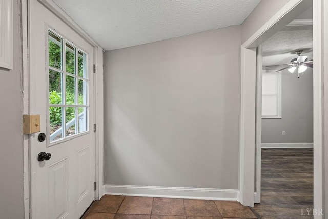 609 Jackson St, Lynchburg, VA 24504 - doorway featuring baseboards, plenty of natural light, and a textured ceiling