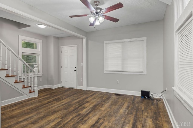 609 Jackson St, Lynchburg, VA 24504 - foyer entrance with wood finished floors, stairs, ceiling fan, and baseboards