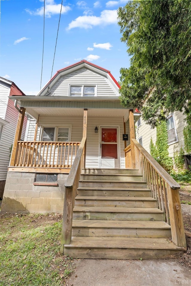 609 Jackson St, Lynchburg, VA 24504 - view of front of house featuring a gambrel roof, a porch, and stairway