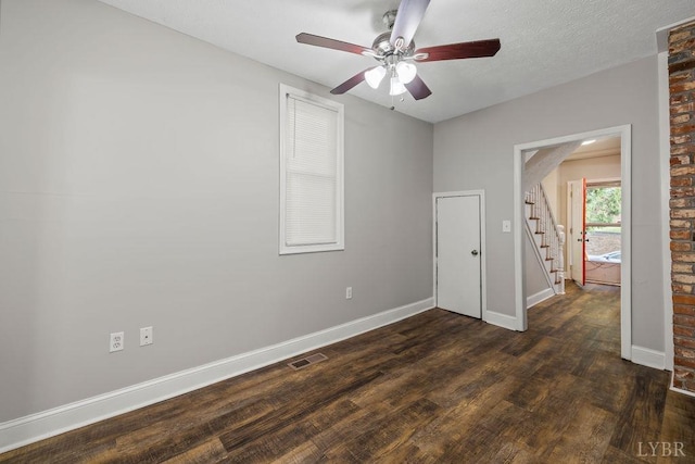 609 Jackson St, Lynchburg, VA 24504 - unfurnished bedroom featuring dark wood-style flooring, baseboards, and ceiling fan
