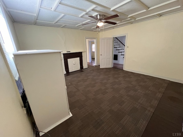 1603 Taylor St, Lynchburg, VA 24504 - empty room featuring ceiling fan, dark carpet, stairs, and baseboards