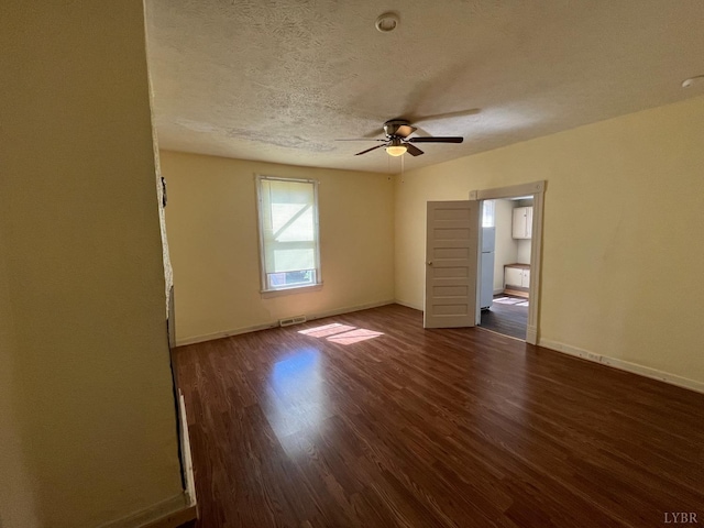 1603 Taylor St, Lynchburg, VA 24504 - unfurnished room with dark wood-type flooring, a ceiling fan, a textured ceiling, and baseboards