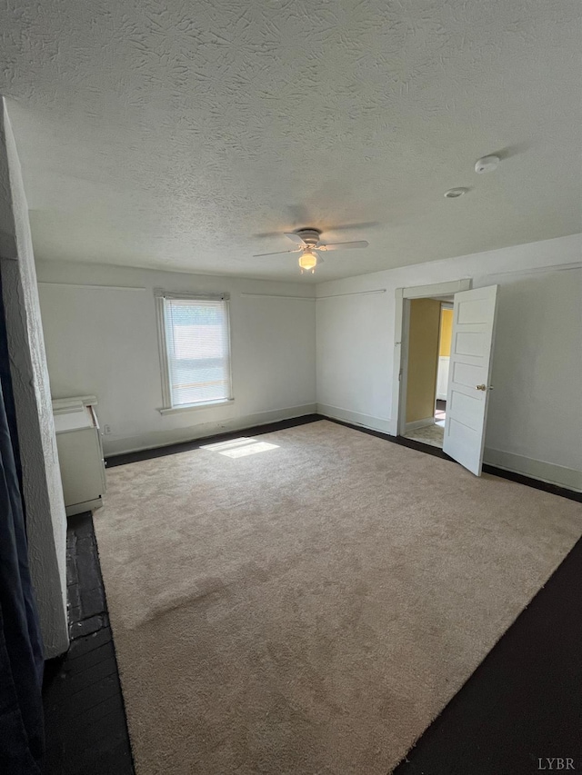 1603 Taylor St, Lynchburg, VA 24504 - empty room featuring a ceiling fan, carpet flooring, a textured ceiling, and a smoke detector
