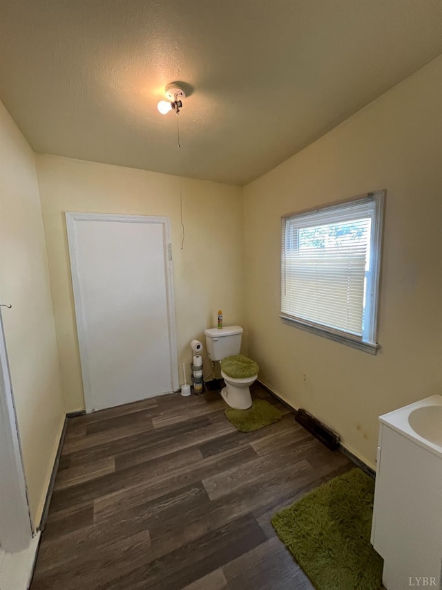 1603 Taylor St, Lynchburg, VA 24504 - bathroom with toilet, wood finished floors, baseboards, and vanity