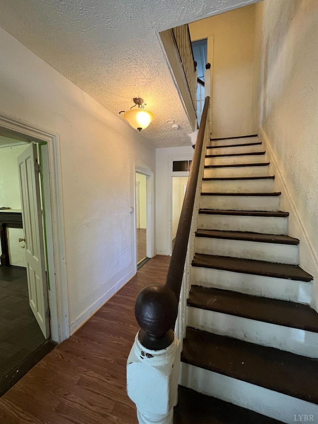 1603 Taylor St, Lynchburg, VA 24504 - stairs featuring wood finished floors and a textured ceiling