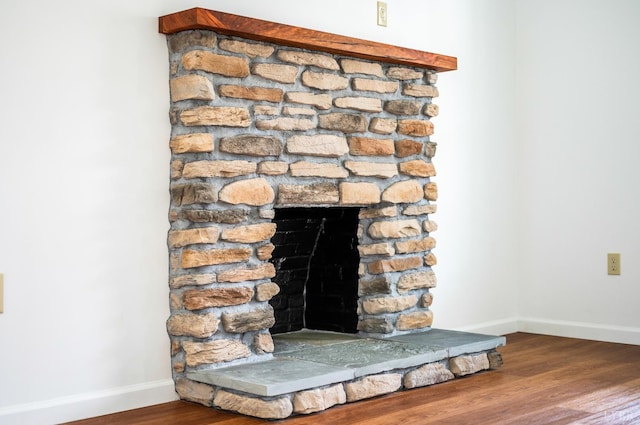 730 Stuart St, Lynchburg, VA 24501 - detailed view of baseboards, wood finished floors, and a fireplace